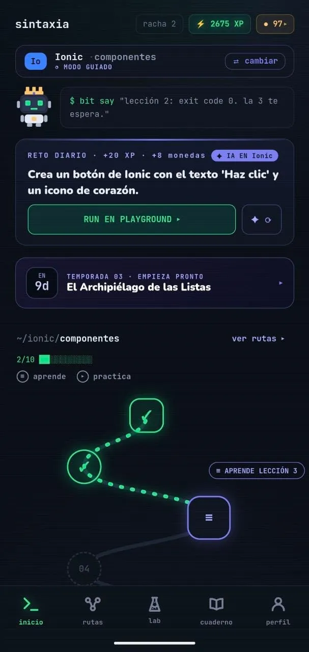 La app móvil en la ruta de Ionic: bit celebra que la lección 2 salió con exit code 0 y la ruta de lecciones avanza con los pasos ya superados en verde.